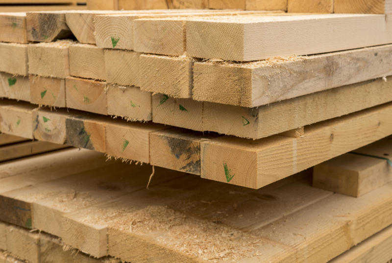 Stacked lengths of sawn pine timber