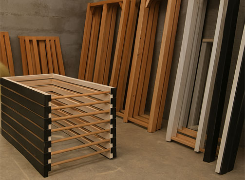 Finished wooden door frames standing in a workshop