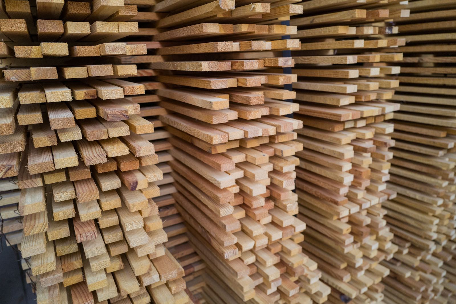 Sawn timber planks stacked in the yard